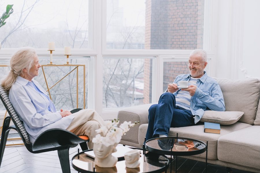 Senior couple laughing together at home