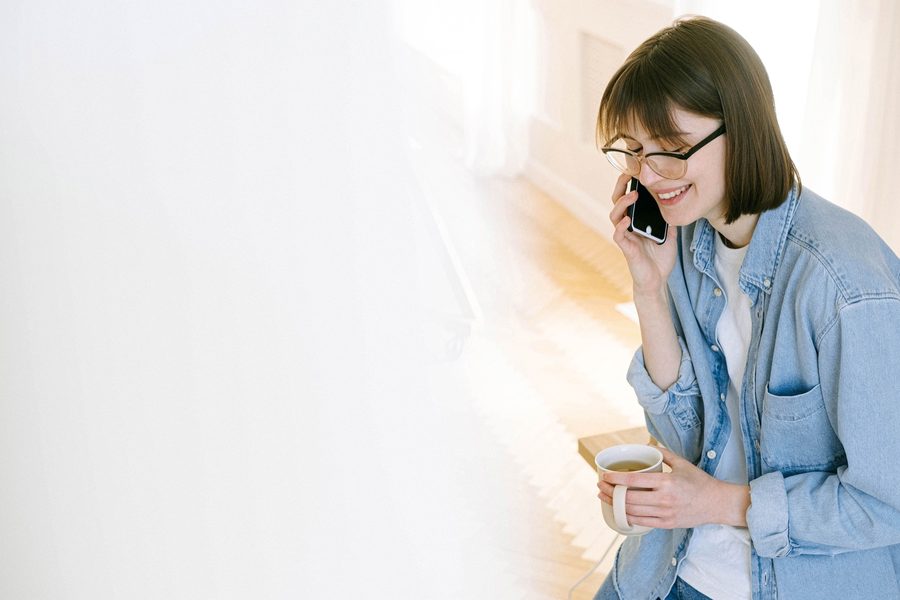 Woman smiling while talking on the phone